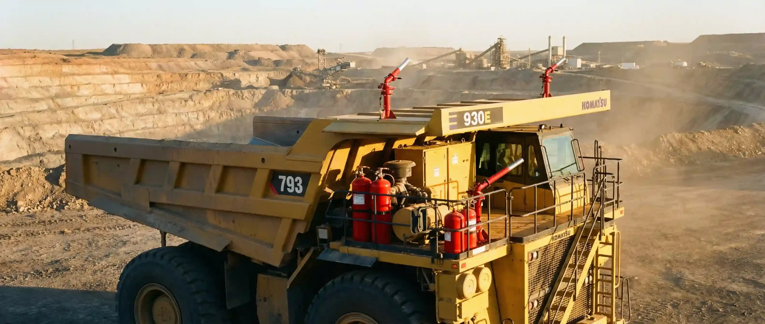 Instalasi sistem fire suppression heavy equipment pada unit haul truck tambang untuk mencegah kebakaran mesin.
